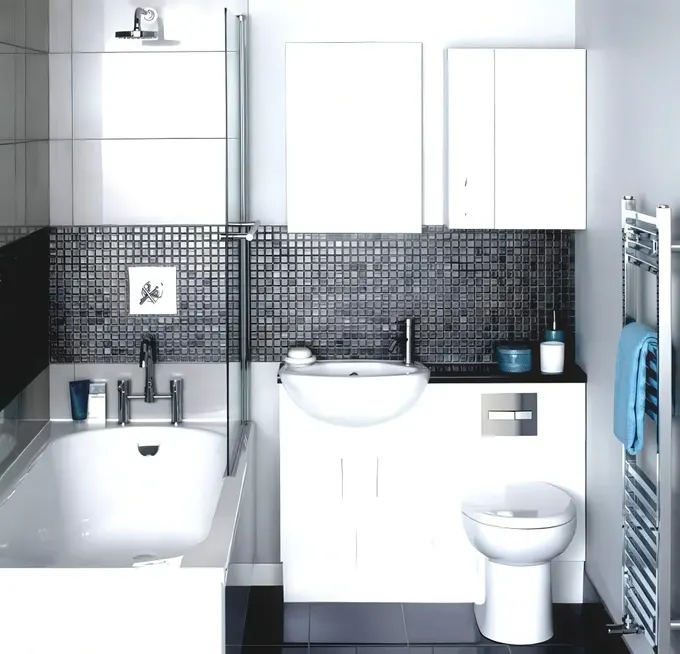 Siyah tezgâh üstüne tasarlanmış lavabo ve tuvalet kombini.